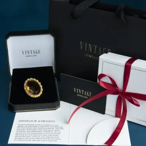 Clearance Gouden broche met saffier en parel 14 krt Broches