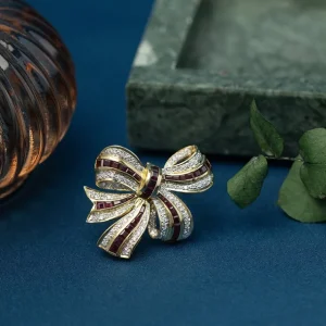 Online Gouden strik broche met robijn en diamant 18 krt Broches